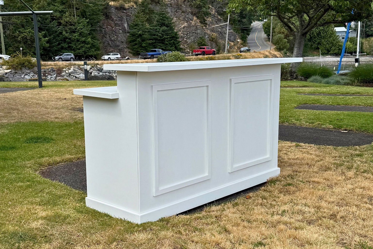 Wedding bar rental setup with shelving and glassware