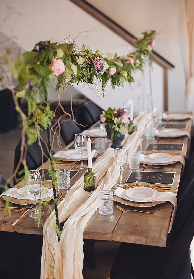 Long table dinner setting inside the Truffle Barn