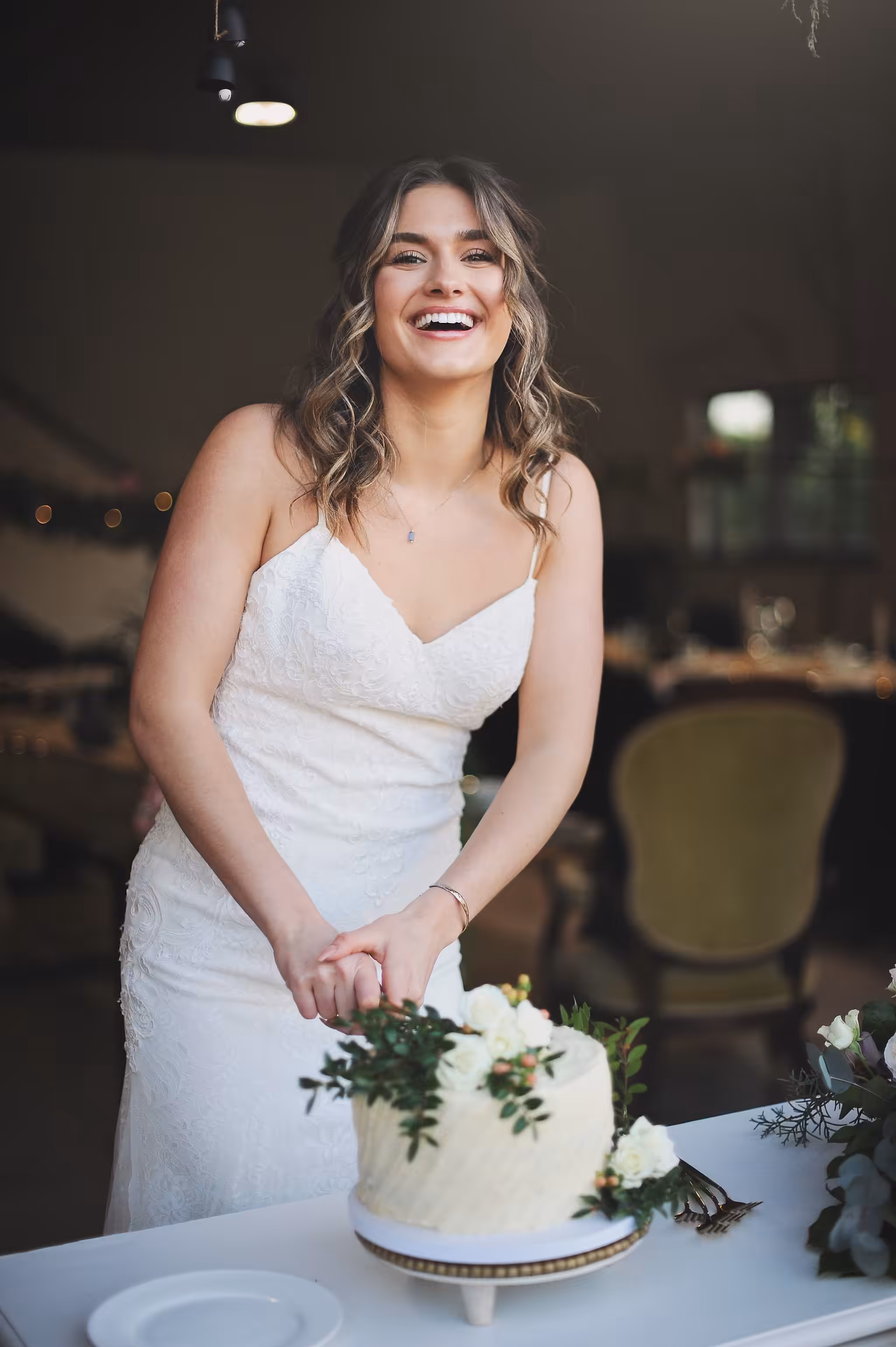 Bride cutting the cake at The Truffle Farm