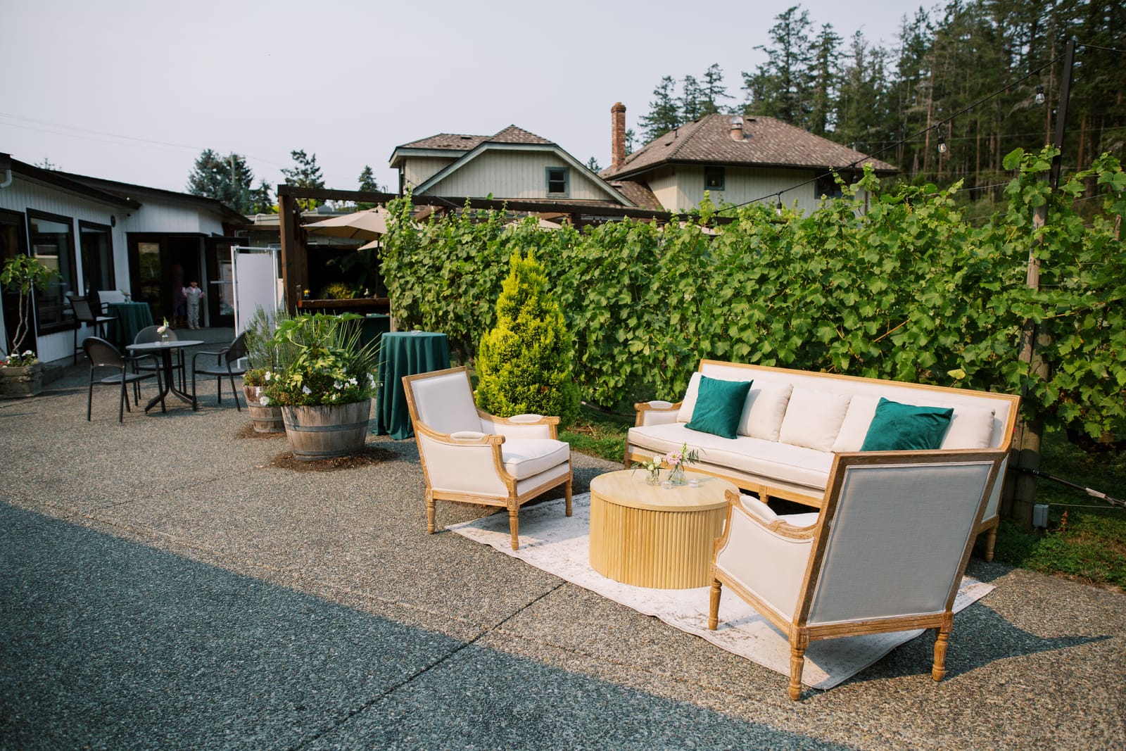 Outdoor lounge and vineyard reception setup at Deep Cove Winery in North Saanich