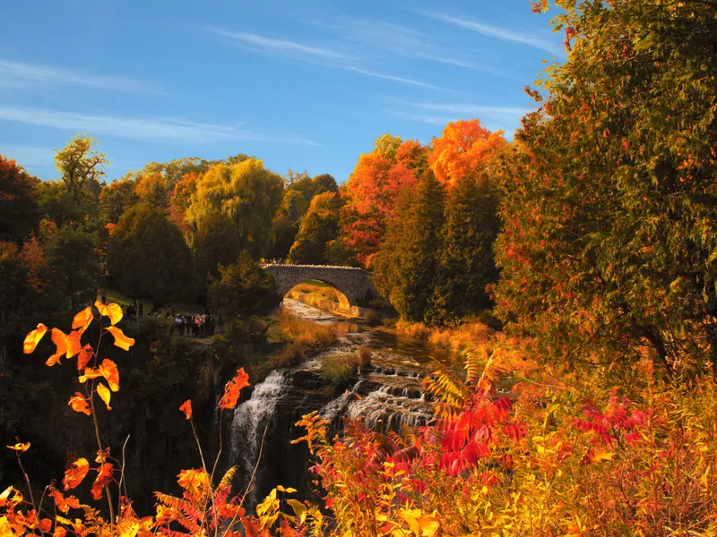 Webster Falls and its stone bridge in autumn near Hamilton